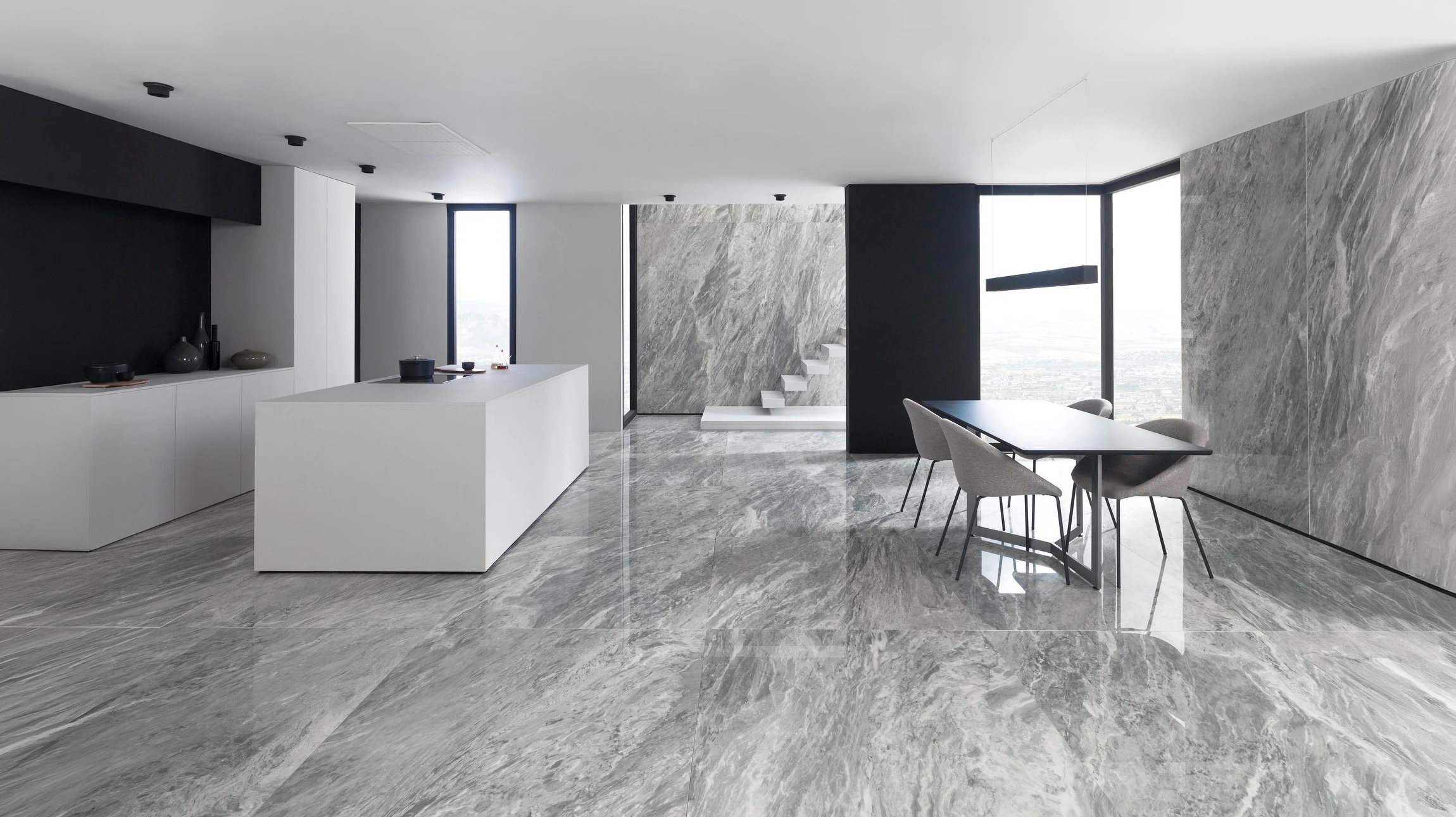 Aménagement extérieur pavé avec galets de rivière multicolores et dalles en pierre naturelle beige